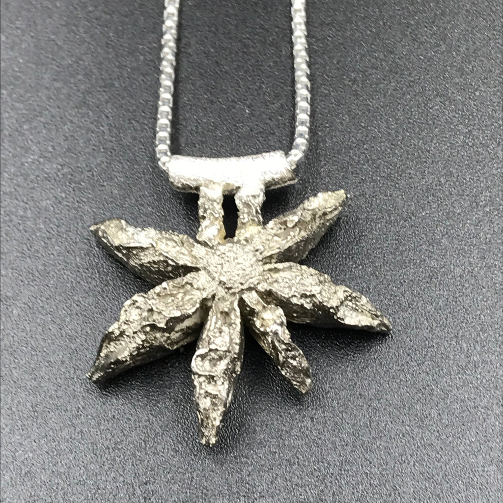 Sterling Silver design of a Star Anise Seed Pendant Necklace